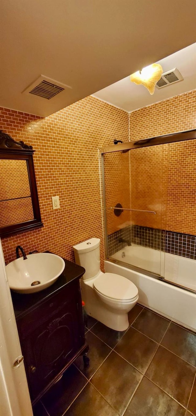 8439 130th St, Kew Gardens, NY 11415 - bathroom with vanity, enclosed tub / shower combo, tile patterned floors, and toilet