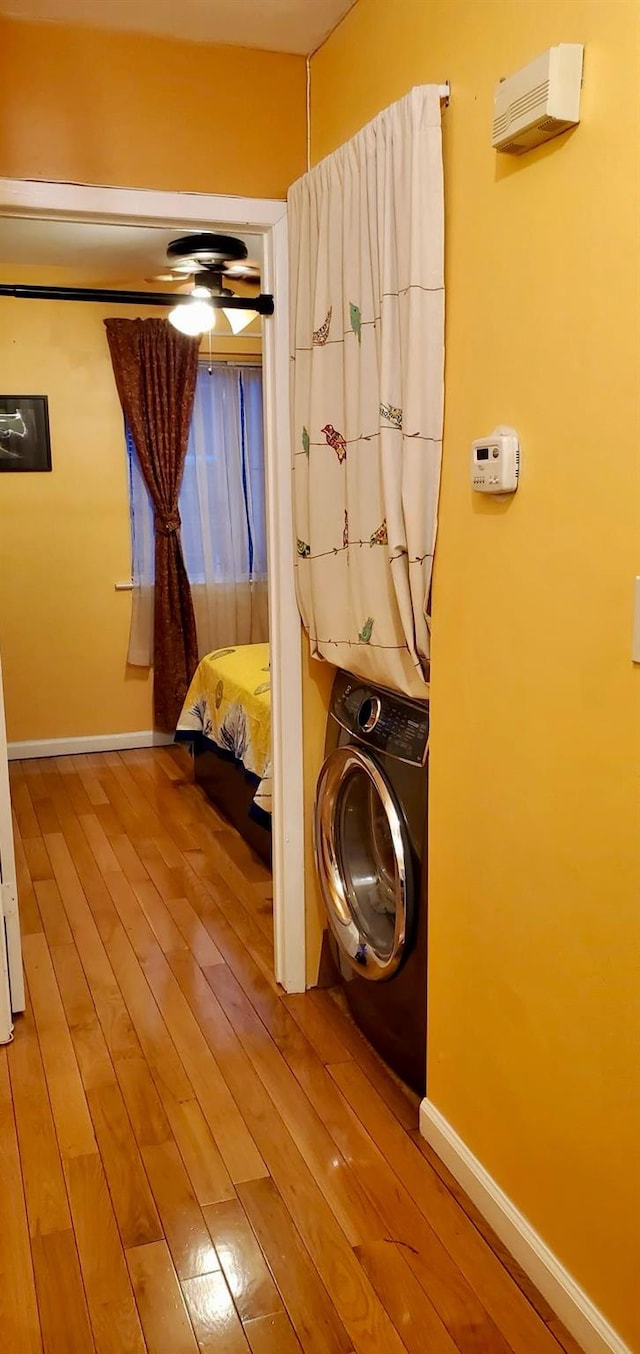 8439 130th St, Kew Gardens, NY 11415 - laundry room featuring washer / clothes dryer, wood finished floors, and baseboards