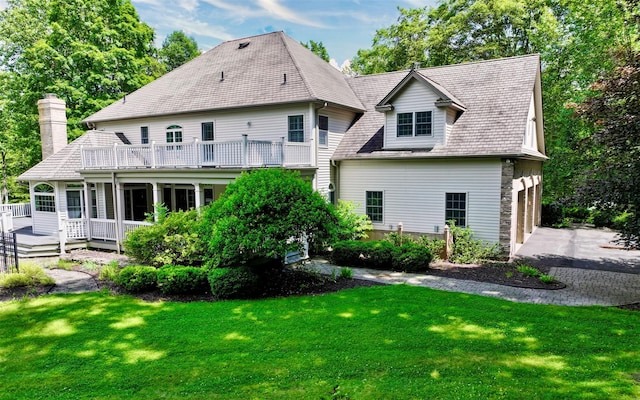 75 Susan Ln, Circleville, NY 10919 - back of property with a chimney, a lawn, a garage, and asphalt driveway