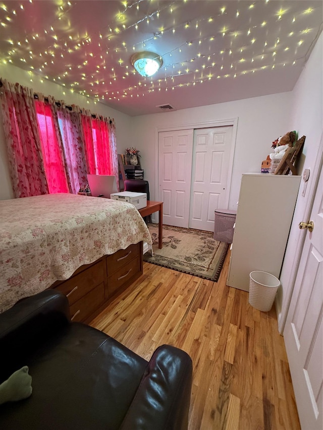 10808 86th St, Ozone Park, NY 11417 - bedroom featuring light wood-style floors and a closet