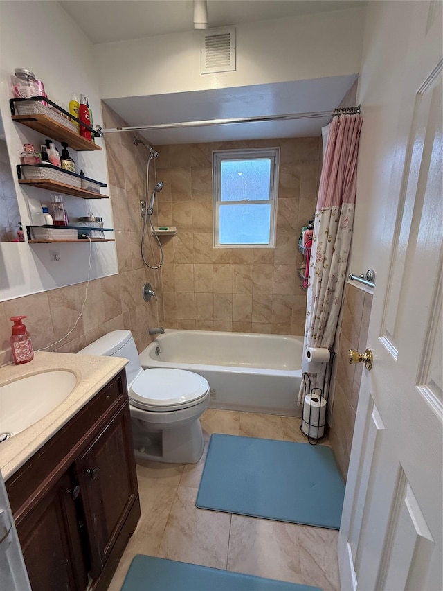 10808 86th St, Ozone Park, NY 11417 - bathroom with shower / bath combo with shower curtain, vanity, toilet, and tile walls