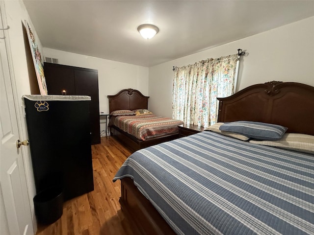 10808 86th St, Ozone Park, NY 11417 - bedroom with light wood-type flooring