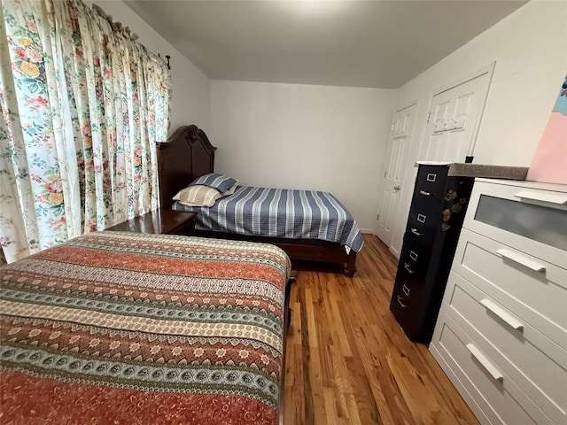 10808 86th St, Ozone Park, NY 11417 - bedroom with light wood-style floors and baseboards