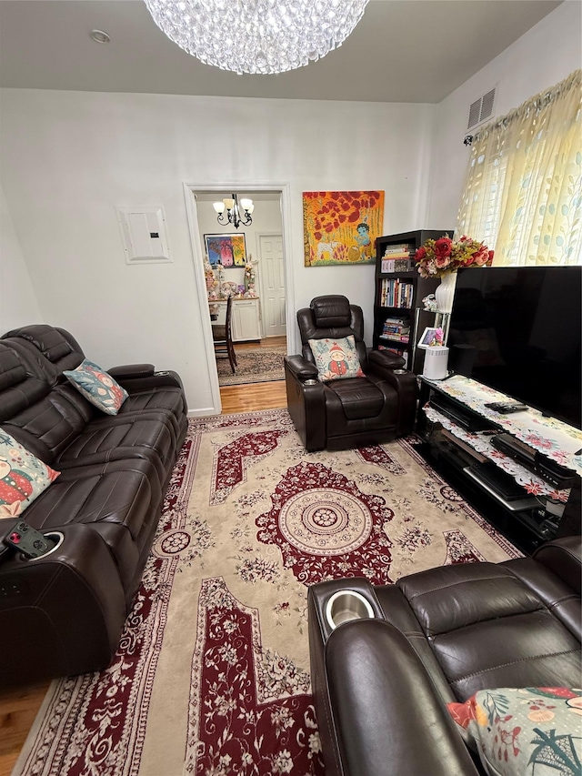 10808 86th St, Ozone Park, NY 11417 - living area with a chandelier and wood finished floors
