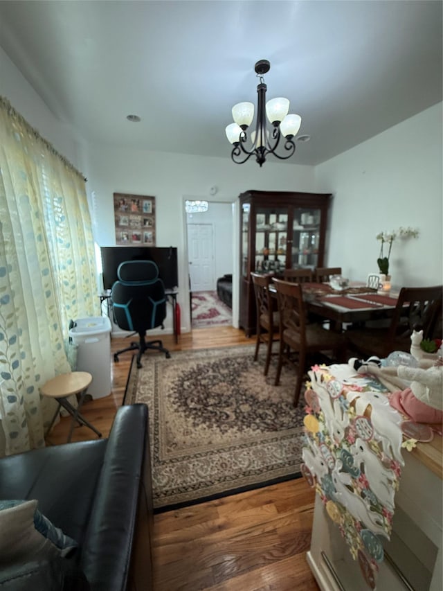 10808 86th St, Ozone Park, NY 11417 - dining area with a chandelier and wood finished floors