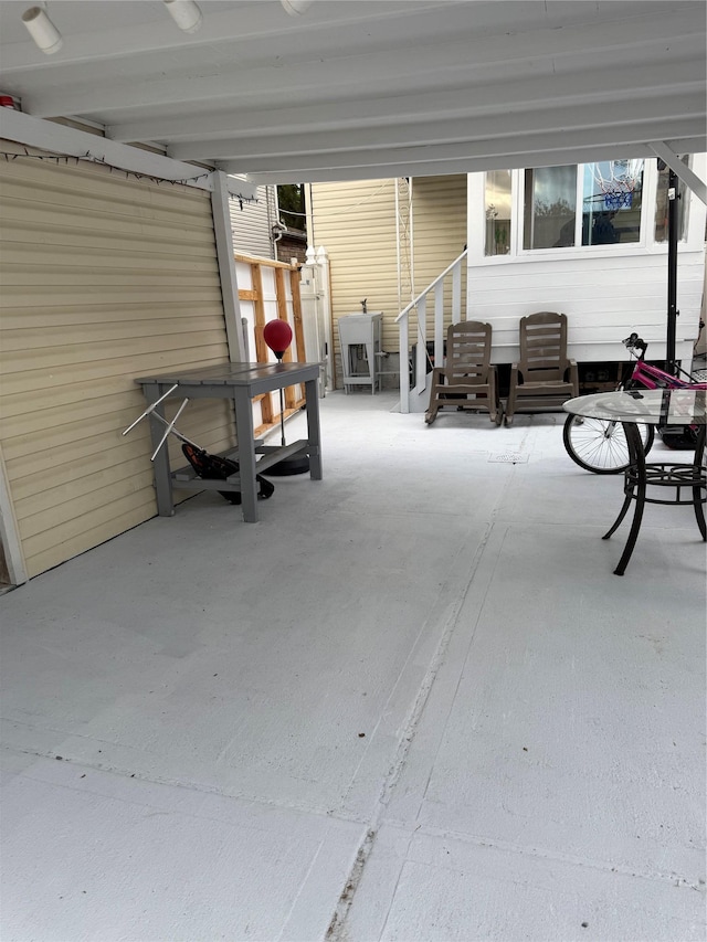 10808 86th St, Ozone Park, NY 11417 - view of patio / terrace with entry steps and a carport