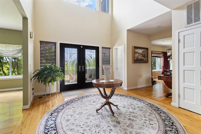 96 Cherry Hill Ct, Briarcliff Manor, NY 10510 - foyer entrance featuring baseboards, a towering ceiling, and light wood-style floors