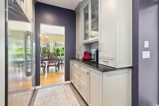 96 Cherry Hill Ct, Briarcliff Manor, NY 10510 - bar area with fridge and a chandelier
