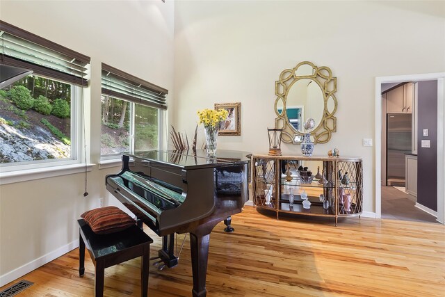 96 Cherry Hill Ct, Briarcliff Manor, NY 10510 - sitting room featuring wood finished floors, baseboards, and a high ceiling