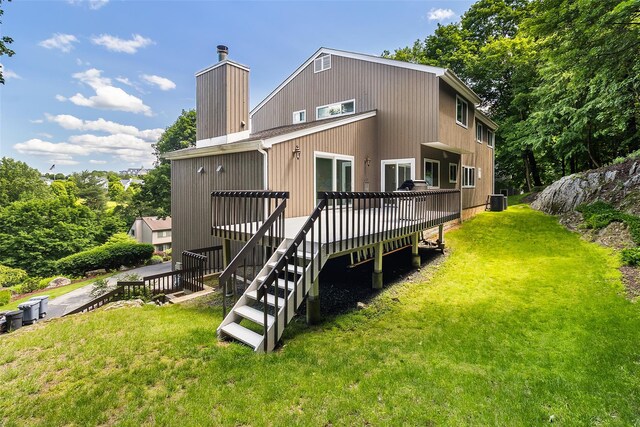 96 Cherry Hill Ct, Briarcliff Manor, NY 10510 - rear view of property with a deck, a lawn, stairs, and central AC