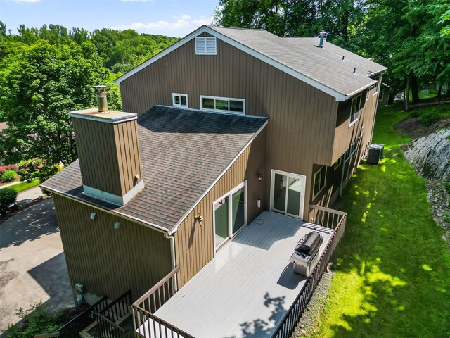 96 Cherry Hill Ct, Briarcliff Manor, NY 10510 - rear view of house with a shingled roof, central AC unit, a deck, and a yard
