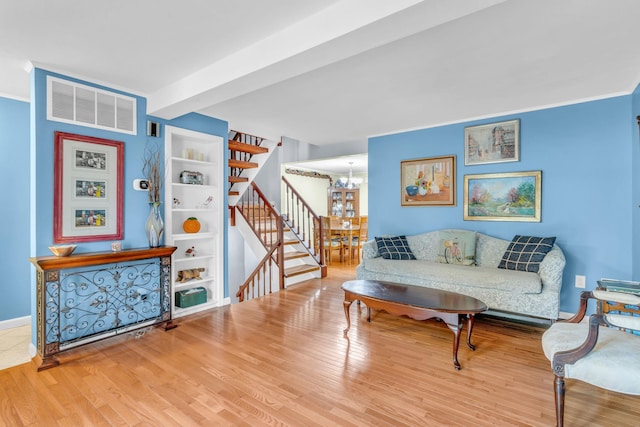 2103 Kings Way Unit 2103, Carmel, NY 10512 - living room with a chandelier, stairs, wood finished floors, and baseboards