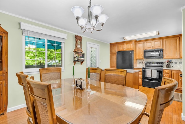 2103 Kings Way Unit 2103, Carmel, NY 10512 - dining area featuring a chandelier, ornamental molding, and light wood-style flooring