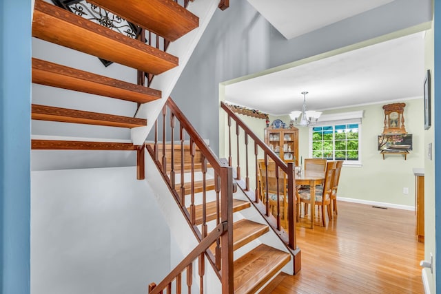 2103 Kings Way Unit 2103, Carmel, NY 10512 - stairway with a chandelier, wood finished floors, and baseboards