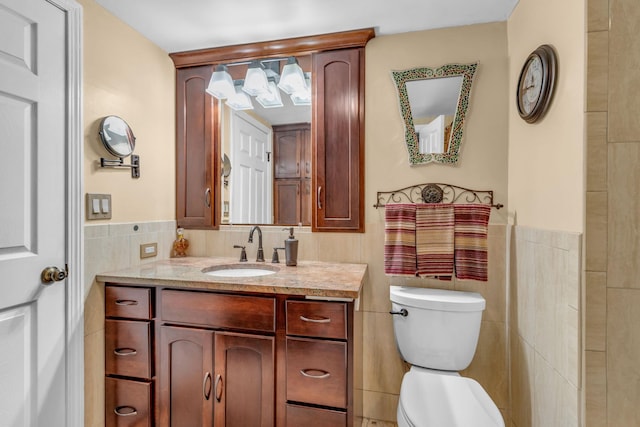 2103 Kings Way Unit 2103, Carmel, NY 10512 - bathroom with toilet, tile walls, vanity, and wainscoting