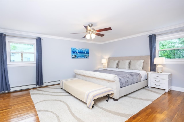 8 Marietta Dr, Westbury, NY 11590 - bedroom featuring light wood-type flooring, ornamental molding, baseboard heating, ceiling fan, and baseboards
