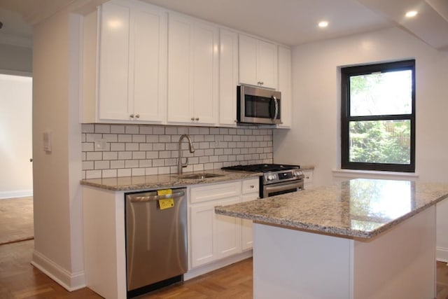 51 White Oak Unit 1H, New Rochelle, NY 10801 - kitchen featuring appliances with stainless steel finishes, a sink, recessed lighting, white cabinetry, and backsplash