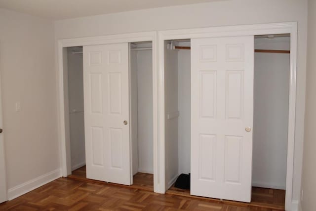 51 White Oak Unit 1H, New Rochelle, NY 10801 - unfurnished bedroom with two closets