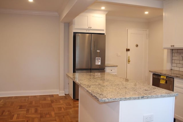 51 White Oak Unit 1H, New Rochelle, NY 10801 - kitchen with stainless steel appliances, a center island, white cabinetry, light stone countertops, and recessed lighting