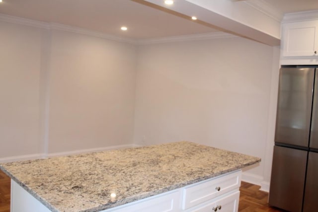 51 White Oak Unit 1H, New Rochelle, NY 10801 - kitchen with freestanding refrigerator, recessed lighting, light stone countertops, a kitchen island, and white cabinetry