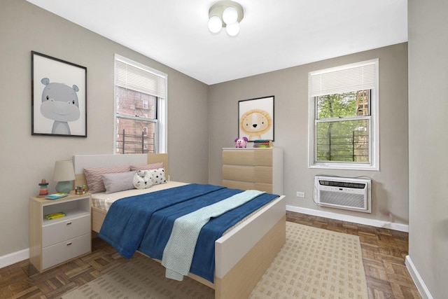 609 Kappock St Unit 3F, Bronx, NY 10463 - bedroom featuring an AC wall unit and baseboards