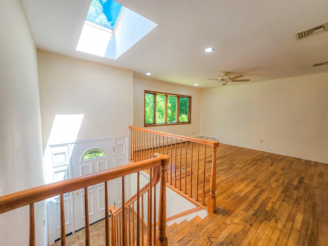 241 Summit Park Rd, Spring Valley, NY 10977 - hallway featuring an upstairs landing, a skylight, wood-type flooring, and recessed lighting