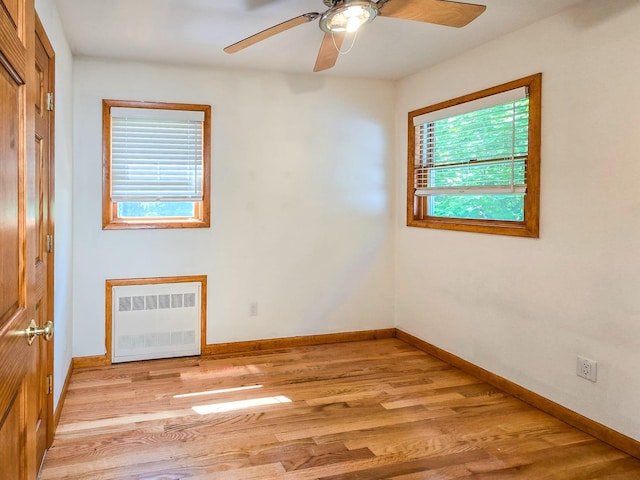 241 Summit Park Rd, Spring Valley, NY 10977 - unfurnished room with radiator heating unit, light wood finished floors, ceiling fan, and baseboards