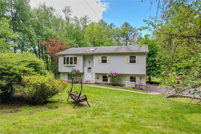 241 Summit Park Rd, Spring Valley, NY 10977 - bi-level home with a front yard and a chimney