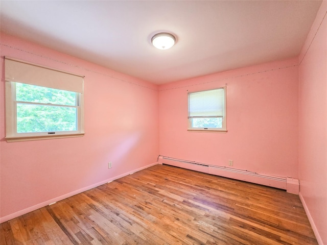 241 Summit Park Rd, Spring Valley, NY 10977 - empty room featuring a baseboard radiator, wood finished floors, and baseboards