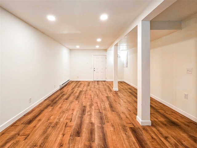 241 Summit Park Rd, Spring Valley, NY 10977 - finished below grade area with a baseboard heating unit, recessed lighting, wood finished floors, and baseboards