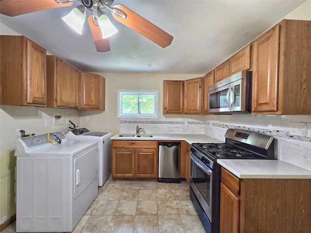 241 Summit Park Rd, Spring Valley, NY 10977 - kitchen with appliances with stainless steel finishes, separate washer and dryer, a sink, and brown cabinetry