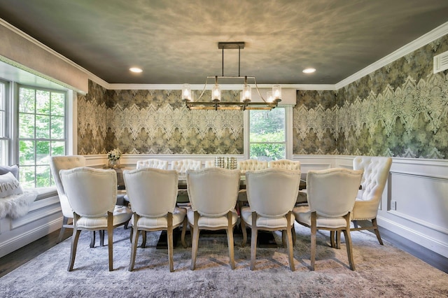 70A Davis Rd, Port Washington, NY 11050 - dining space featuring crown molding, a chandelier, wainscoting, wood finished floors, and wallpapered walls