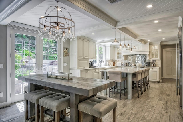 70A Davis Rd, Port Washington, NY 11050 - dining room featuring a chandelier, wood ceiling with exposed beams, light wood-style floors, recessed lighting, and crown molding