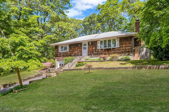 29 Patchogue Rd, Sound Beach, NY 11789 - view of front of property featuring a front yard and a chimney