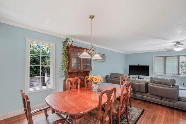 29 Patchogue Rd, Sound Beach, NY 11789 - dining space with light wood-type flooring, ornamental molding, and a ceiling fan