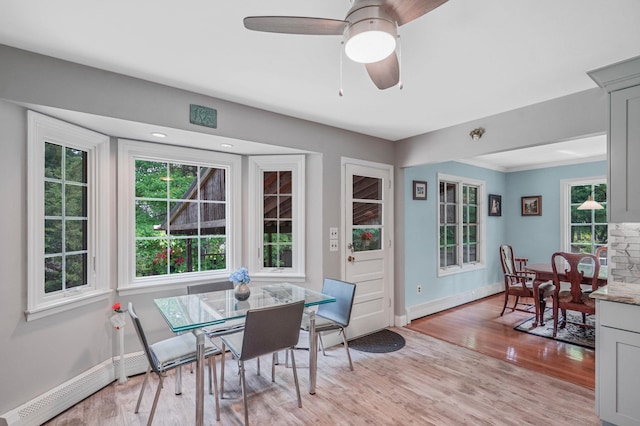 29 Patchogue Rd, Sound Beach, NY 11789 - dining area with plenty of natural light, light wood finished floors, and ceiling fan