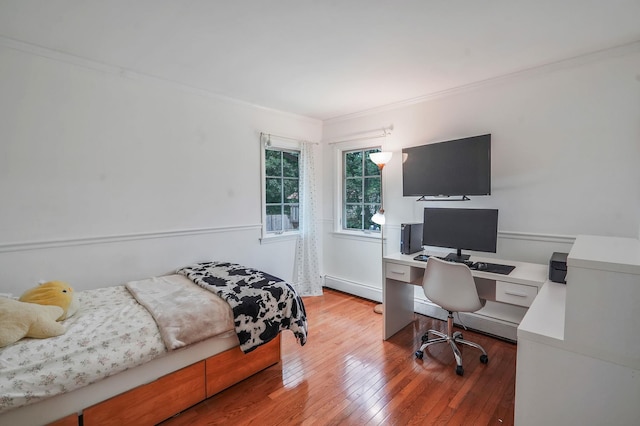29 Patchogue Rd, Sound Beach, NY 11789 - bedroom featuring baseboard heating, a desk, crown molding, and hardwood / wood-style floors