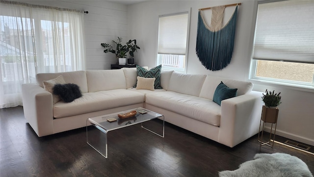 41 Michigan St, Long Beach, NY 11561 - living area with healthy amount of natural light and dark wood-style floors