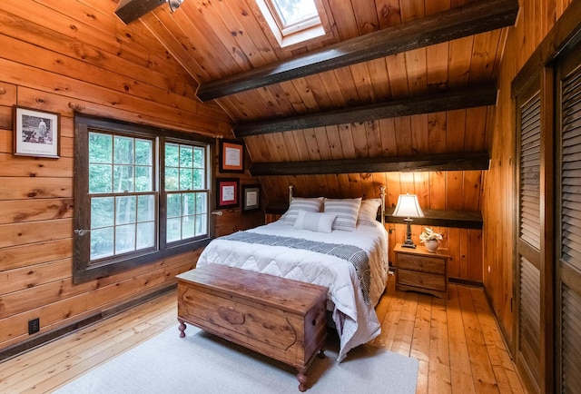 1206 Hollow Rd, Clinton Corners, NY 12514 - bedroom featuring wooden walls, light wood-style floors, a skylight, and wood ceiling