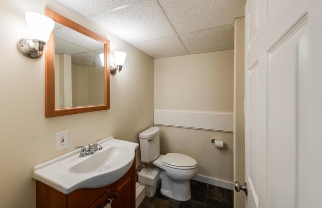 1206 Hollow Rd, Clinton Corners, NY 12514 - bathroom featuring a paneled ceiling, vanity, toilet, and baseboards