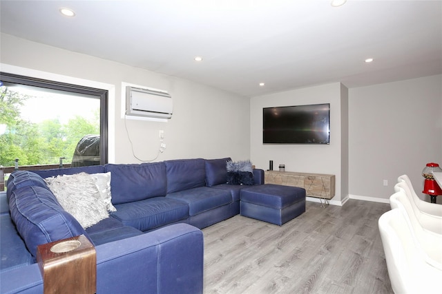221 Richard Ct, Pomona, NY 10970 - living area with a wall unit AC, light wood finished floors, recessed lighting, and baseboards