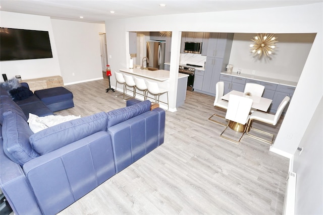 221 Richard Ct, Pomona, NY 10970 - living room featuring light wood finished floors, recessed lighting, and baseboards