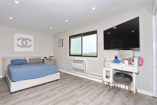 221 Richard Ct, Pomona, NY 10970 - bedroom featuring wood finished floors, a wall unit AC, recessed lighting, baseboard heating, and baseboards