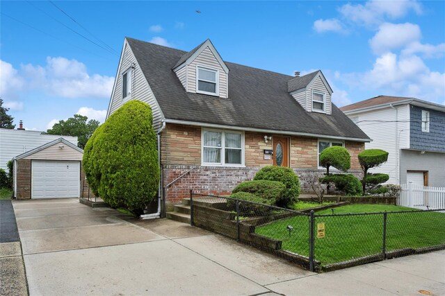 1343 E St, Elmont, NY 11003 - new england style home with concrete driveway, a garage, stone siding, an outbuilding, and a shingled roof