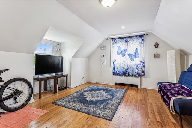 1343 E St, Elmont, NY 11003 - sitting room with vaulted ceiling, hardwood / wood-style floors, and baseboards