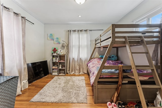 1343 E St, Elmont, NY 11003 - bedroom featuring wood finished floors and crown molding
