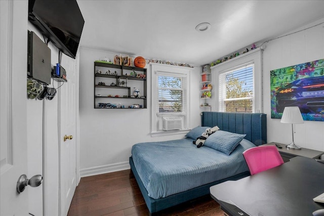 23 Bonta St, Elmont, NY 11003 - bedroom featuring wood finished floors, baseboards, and cooling unit
