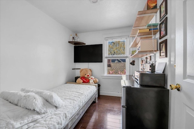 23 Bonta St, Elmont, NY 11003 - bedroom featuring freestanding refrigerator, baseboards, and dark wood-style floors