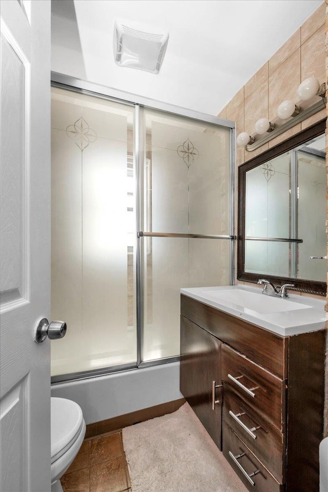 23 Bonta St, Elmont, NY 11003 - bathroom featuring vanity, toilet, and combined bath / shower with glass door