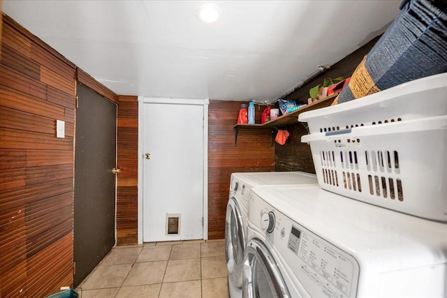 23 Bonta St, Elmont, NY 11003 - laundry area with washer and clothes dryer, light tile patterned floors, and wood walls
